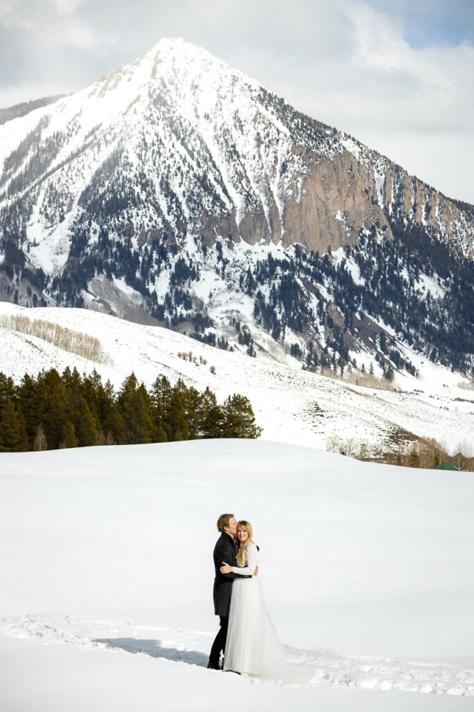 private winter snowy scene snow storm intimate weddings lights elopement elope Crested Butte photographer professional photography Colorado intimate wedding photographers - photo by Mountain Magic Media