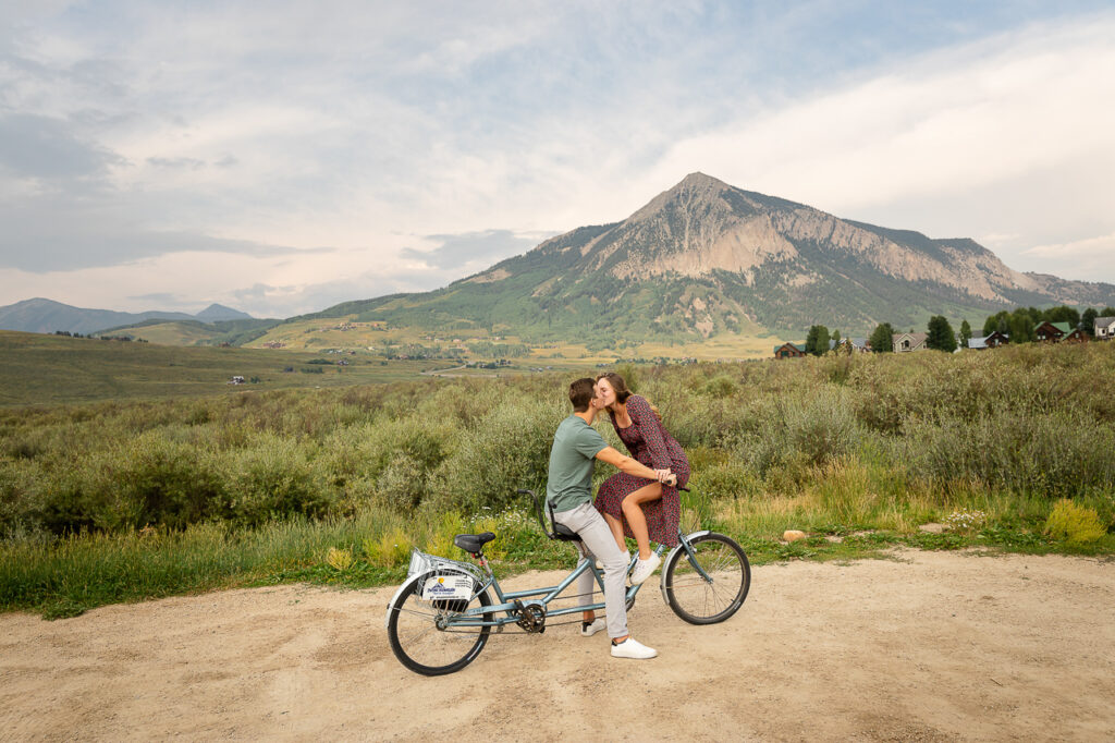 tandem bike kissing kiss Purple Mountain Bed and Breakfast Lodge Elk Ave Crested Butte photographer Gunnison photographers Colorado photography - proposal engagement elopement wedding venue - photo by Mountain Magic Media