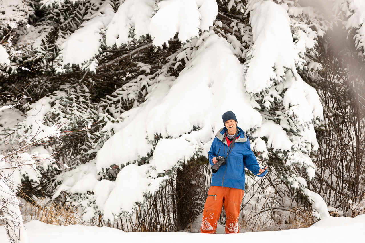 holding camera snow skiing on mountain photoshoot Crested Butte photographer Gunnison photographers Colorado photography - proposal engagement elopement wedding venue - photo by Mountain Magic Media