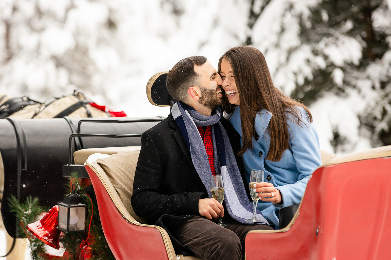 Aspen Carriage and Sleigh snowy Aspen, CO surprise proposal sleigh ride winter blue coat engagement diamond ring Crested Butte photographer Gunnison photographers Colorado photography - proposal engagement elopement wedding venue - photo by Mountain Magic Media