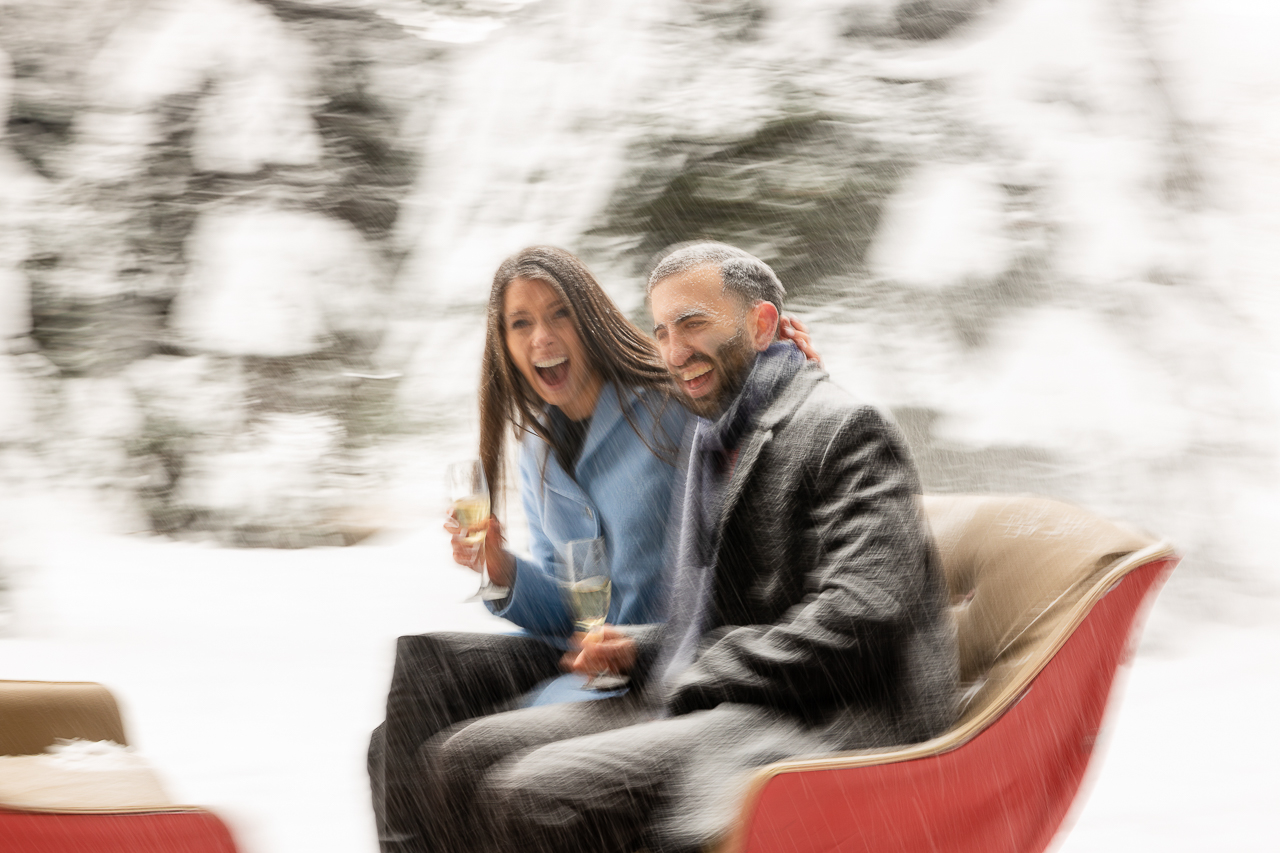 Aspen Carriage and Sleigh snowy Aspen, CO surprise proposal sleigh ride winter blue coat engagement diamond ring Crested Butte photographer Gunnison photographers Colorado photography - proposal engagement elopement wedding venue - photo by Mountain Magic Media