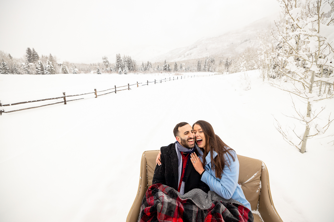 Aspen Carriage and Sleigh snowy Aspen, CO surprise proposal sleigh ride winter blue coat engagement diamond ring Crested Butte photographer Gunnison photographers Colorado photography - proposal engagement elopement wedding venue - photo by Mountain Magic Media