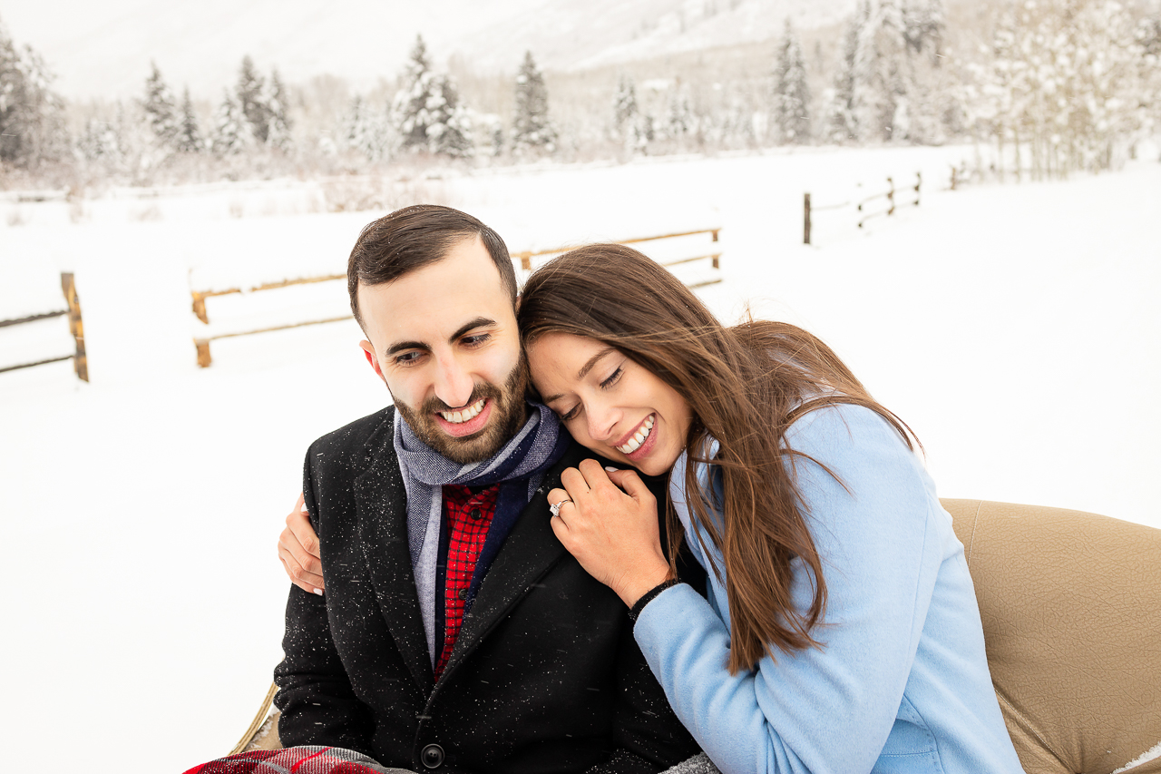 Aspen Carriage and Sleigh snowy Aspen, CO surprise proposal sleigh ride winter blue coat engagement diamond ring Crested Butte photographer Gunnison photographers Colorado photography - proposal engagement elopement wedding venue - photo by Mountain Magic Media