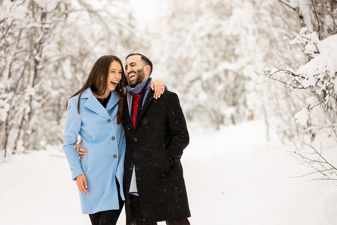 Aspen Carriage and Sleigh snowy Aspen, CO surprise proposal sleigh ride winter blue coat engagement diamond ring Crested Butte photographer Gunnison photographers Colorado photography - proposal engagement elopement wedding venue - photo by Mountain Magic Media