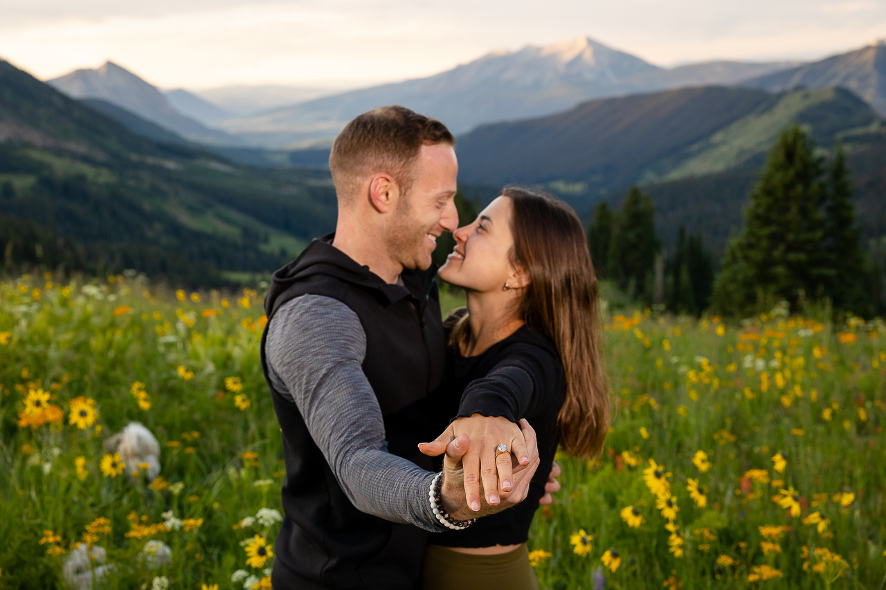 holding custom diamond ring out engaged couple Crested Butte photographer Gunnison photographers Colorado photography - proposal engagement elopement wedding venue - photo by Mountain Magic Media