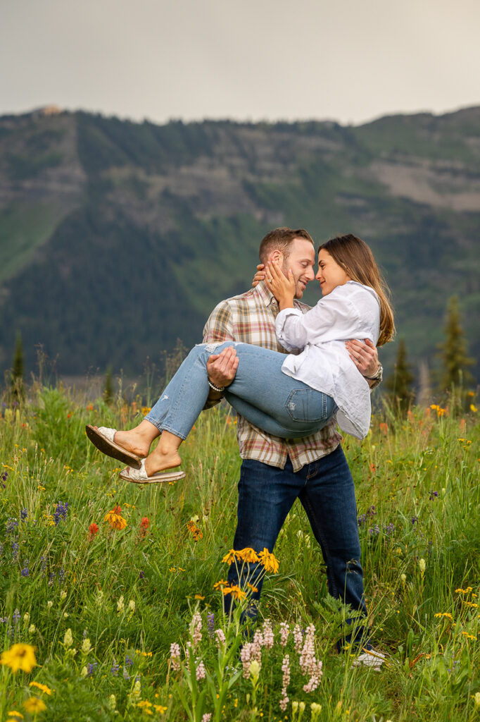 engaged couple holding Crested Butte photographer Gunnison photographers Colorado photography - proposal engagement elopement wedding venue - photo by Mountain Magic Media