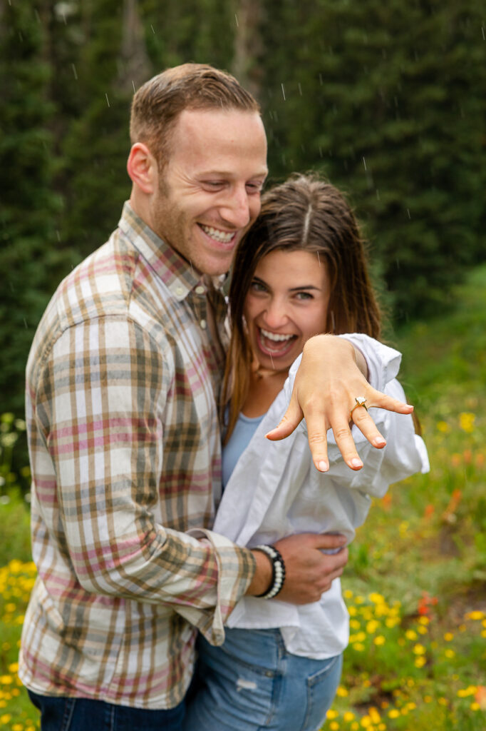 engaged couple holding out custom diamond ring Crested Butte photographer Gunnison photographers Colorado photography - proposal engagement elopement wedding venue - photo by Mountain Magic Media