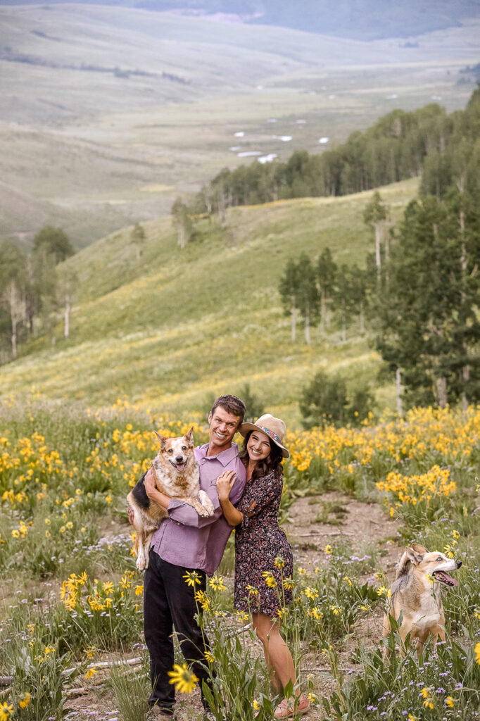 about us bio holding dog couple Crested Butte photographer Gunnison photographers Colorado photography - proposal engagement elopement wedding venue - photo by Mountain Magic Media