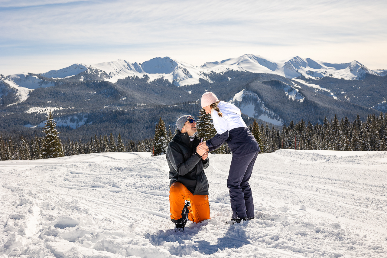 snowy winter excitement surprise proposal on one knee mountains background Crested Butte photographer Gunnison photographers Colorado photography - proposal engagement elopement wedding venue - photo by Mountain Magic Media