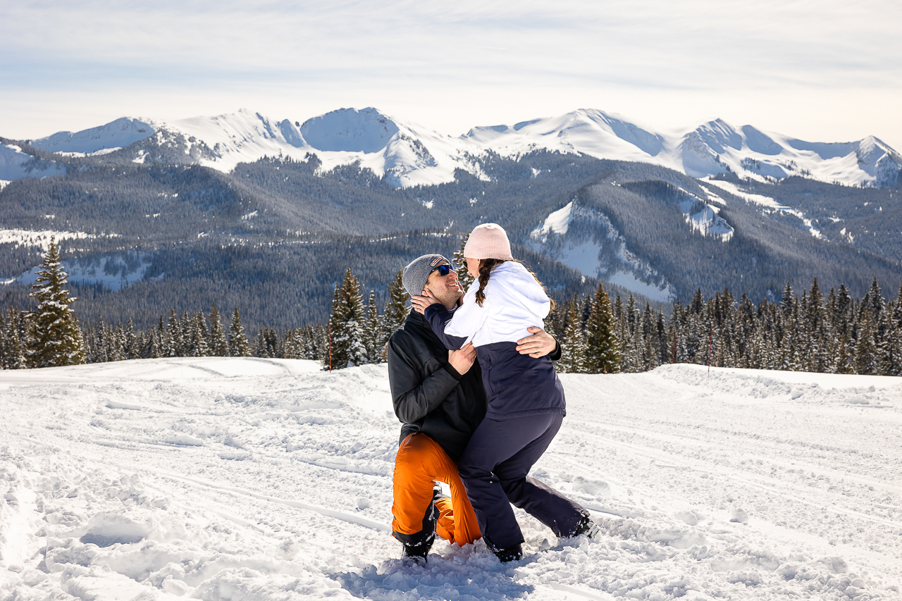 snowy winter excitement surprise proposal on one knee mountains background Crested Butte photographer Gunnison photographers Colorado photography - proposal engagement elopement wedding venue - photo by Mountain Magic Media