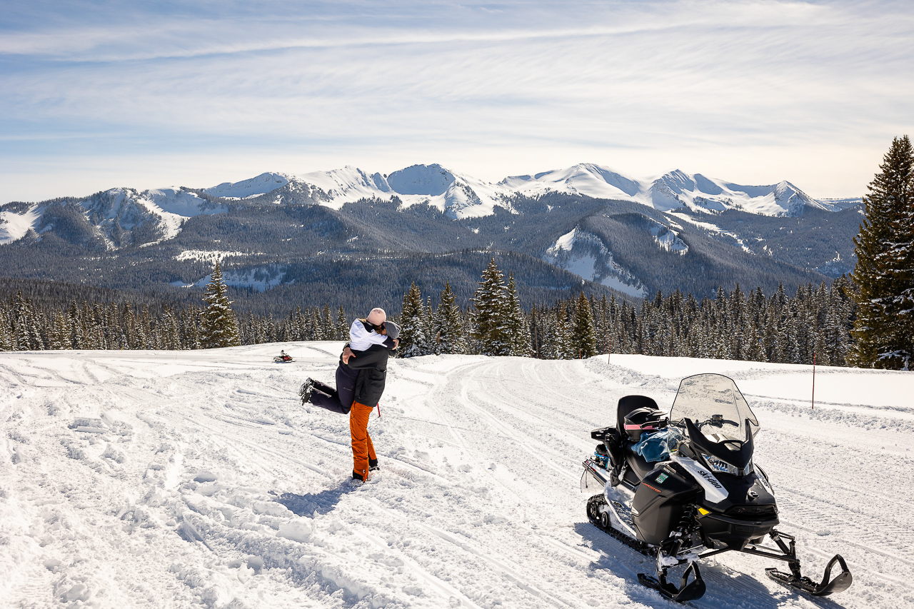 snowy winter excitement surprise proposal on one knee mountains background Crested Butte photographer Gunnison photographers Colorado photography - proposal engagement elopement wedding venue - photo by Mountain Magic Media