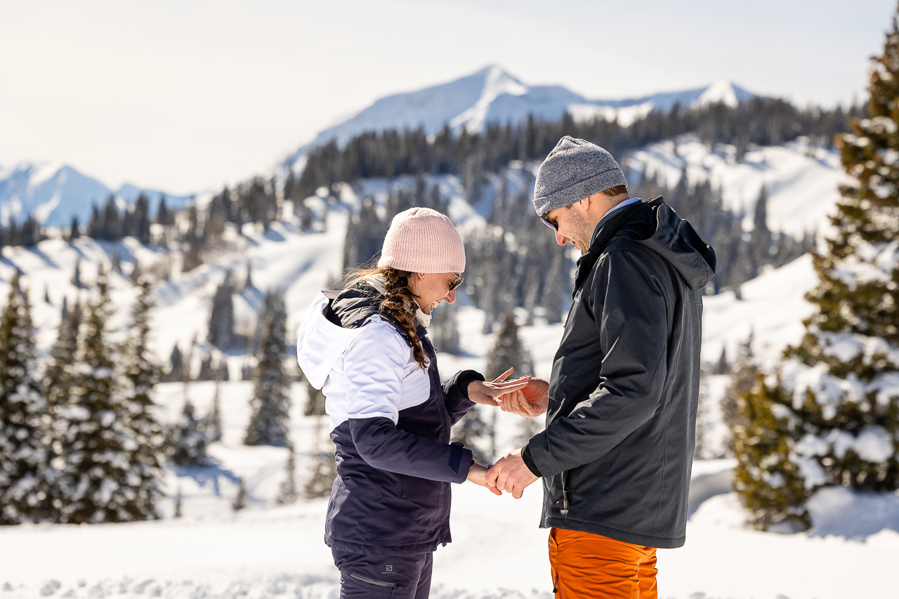 snowy winter excitement surprise proposal on one knee mountains background Crested Butte photographer Gunnison photographers Colorado photography - proposal engagement elopement wedding venue - photo by Mountain Magic Media