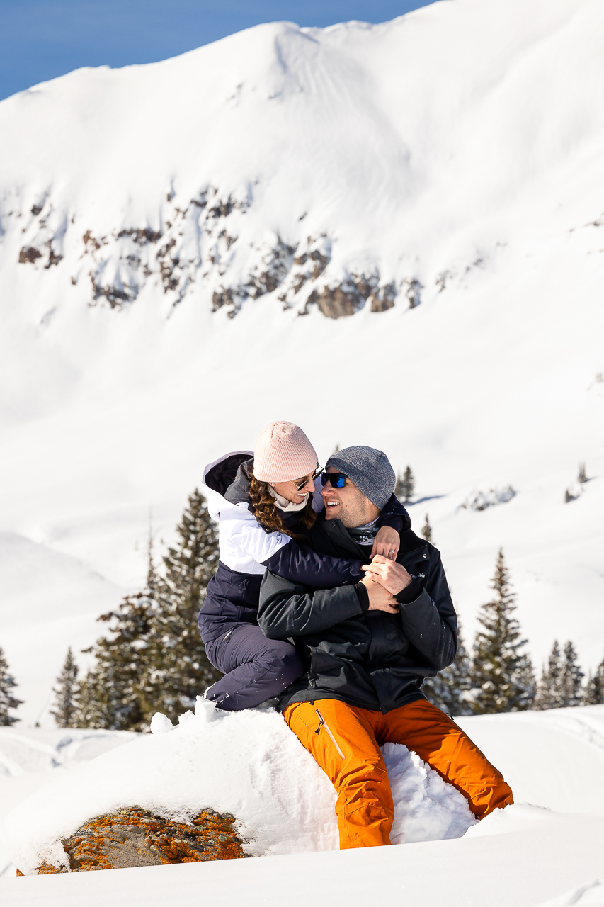 snowy winter excitement surprise proposal on one knee mountains background Crested Butte photographer Gunnison photographers Colorado photography - proposal engagement elopement wedding venue - photo by Mountain Magic Media