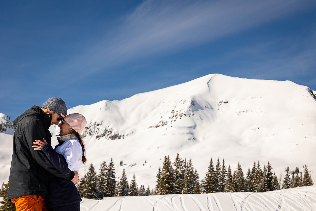 snowy winter excitement surprise proposal on one knee mountains background Crested Butte photographer Gunnison photographers Colorado photography - proposal engagement elopement wedding venue - photo by Mountain Magic Media