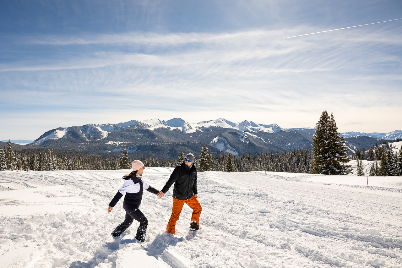 snowy winter excitement surprise proposal on one knee mountains background Crested Butte photographer Gunnison photographers Colorado photography - proposal engagement elopement wedding venue - photo by Mountain Magic Media