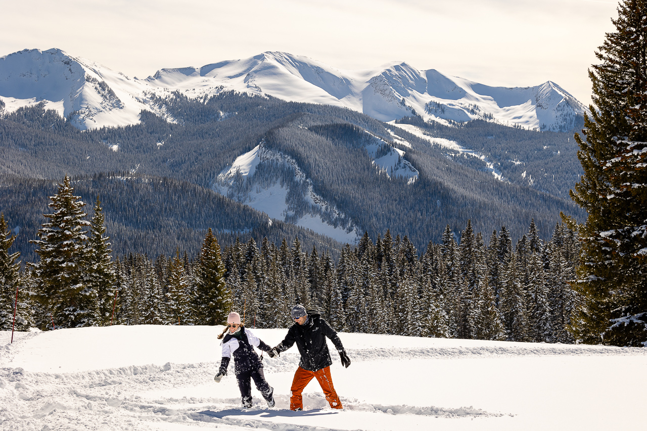 snowy winter excitement surprise proposal on one knee mountains background Crested Butte photographer Gunnison photographers Colorado photography - proposal engagement elopement wedding venue - photo by Mountain Magic Media