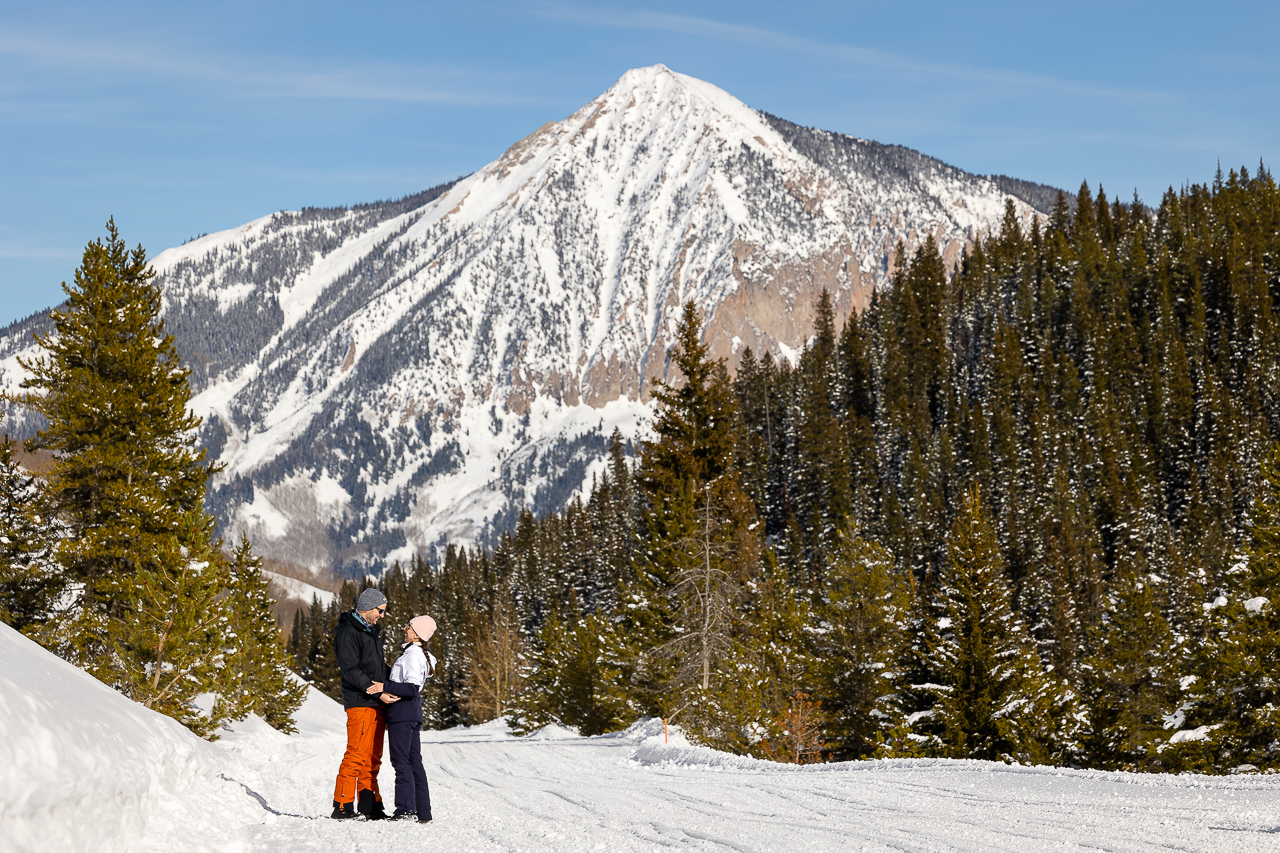 snowy winter excitement surprise proposal on one knee mountains background Crested Butte photographer Gunnison photographers Colorado photography - proposal engagement elopement wedding venue - photo by Mountain Magic Media