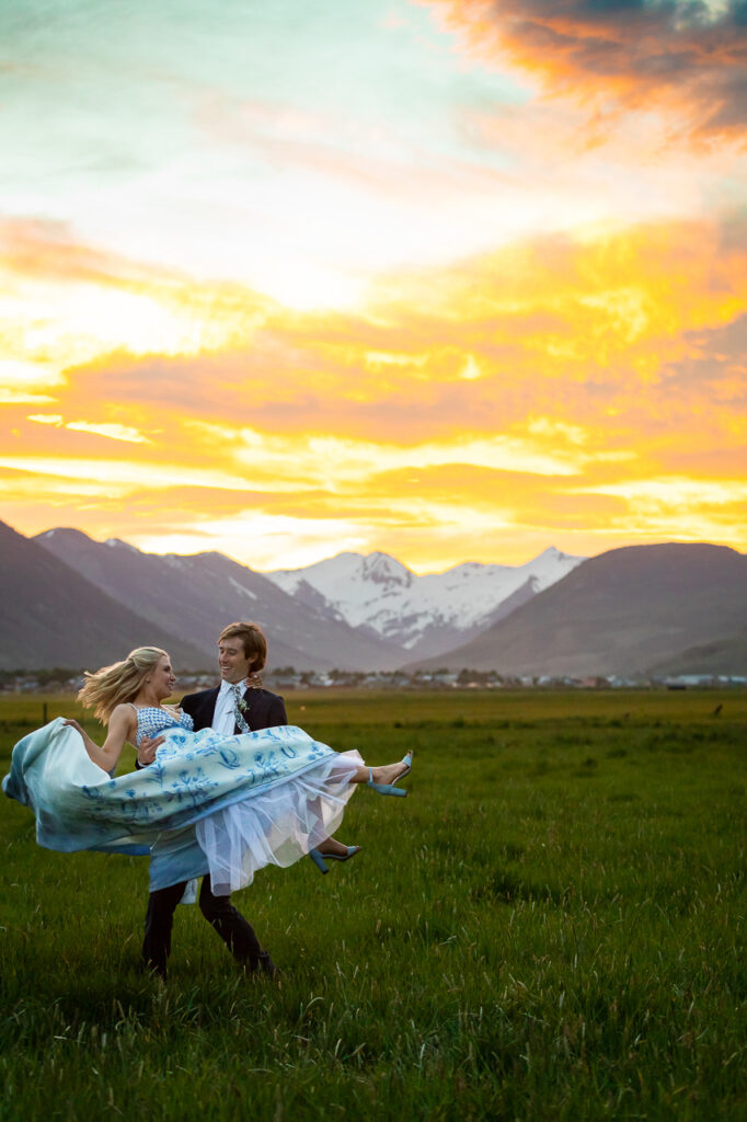 Town Ranch Wedding groom holding bride twirling Crested Butte photographer Gunnison photographers Colorado photography - proposal engagement elopement wedding venue - photo by Mountain Magic Media
