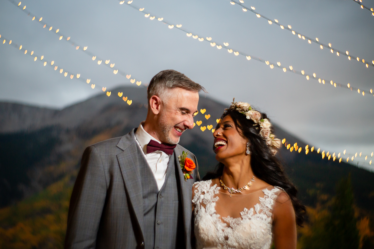 couple smiling bokeh lighting heart lights Crested Butte photographer Gunnison photographers Colorado photography - proposal engagement elopement wedding venue - photo by Mountain Magic Media