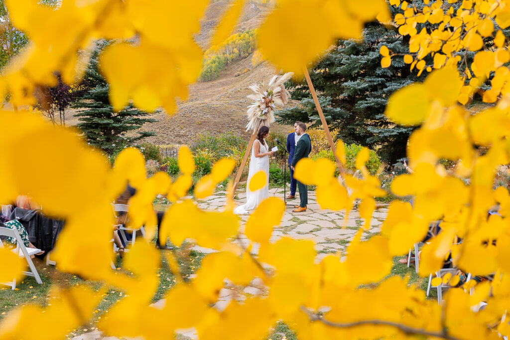 reading vows newlyweds couple just married wedding day Mountain Wedding Garden Crested Butte florals by Fin + Ally florist, plus planning and rentals by Lucky Penny Events