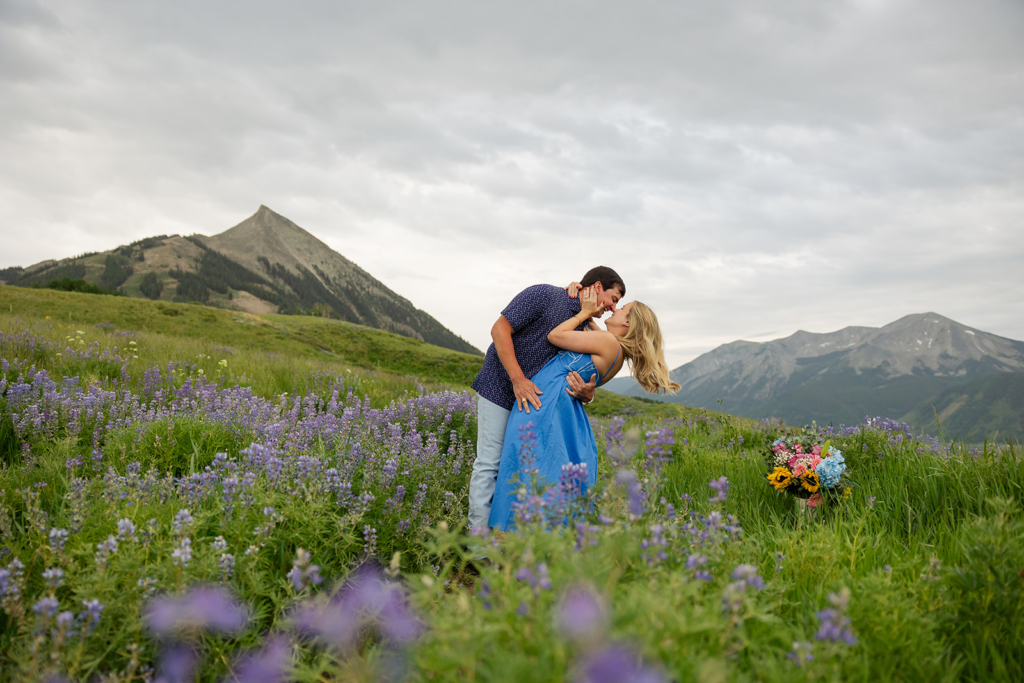Emotional proposal moment with mountain backdrop Crested Butte Colorado